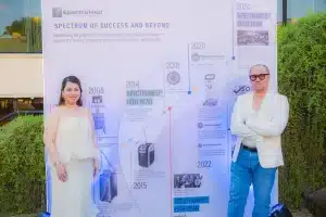 Guests pose with the history wall