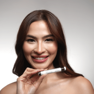 Photo of Hydrafacial Ambassador holding the JLO Beauty Booster
